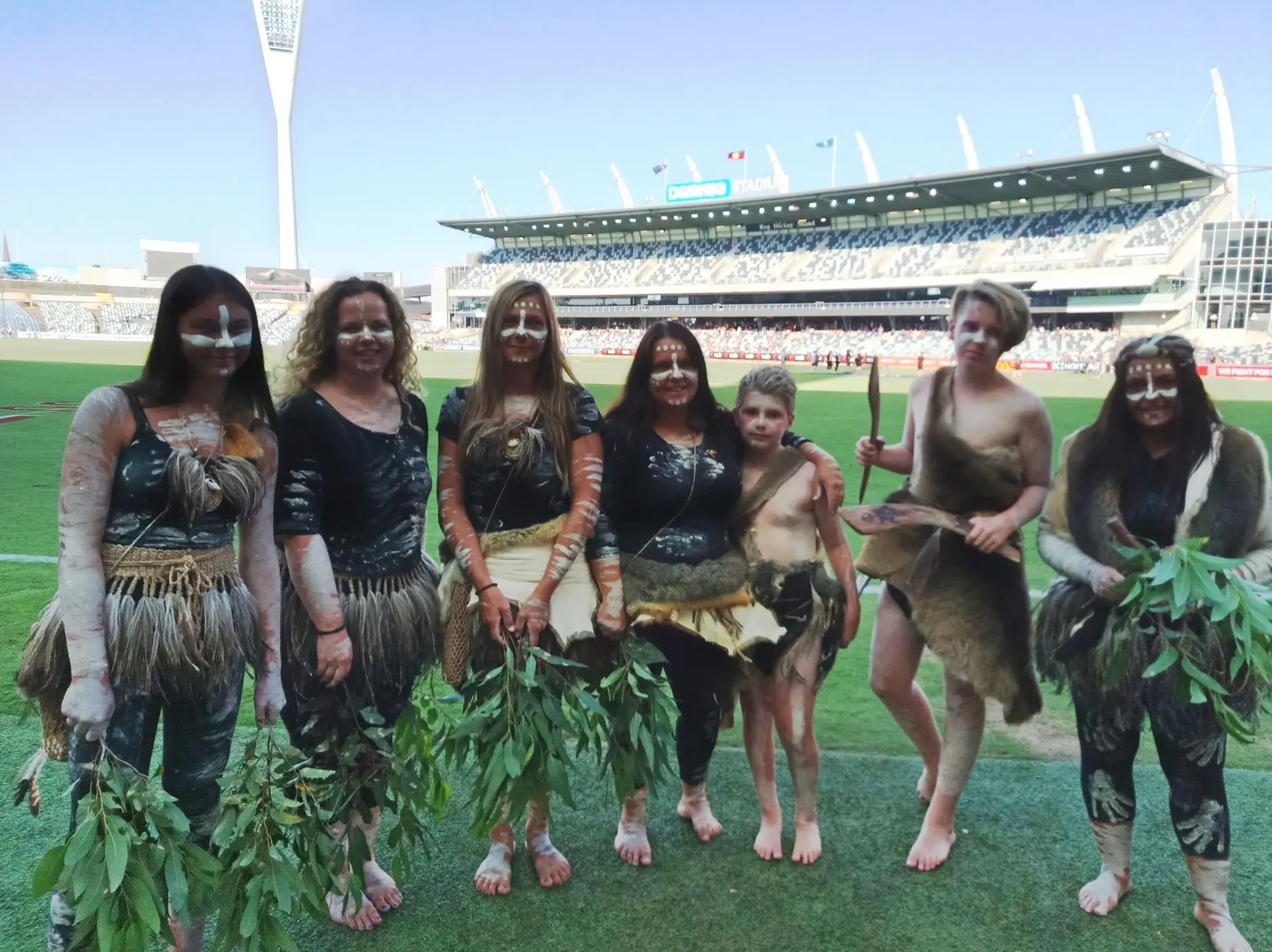 Wadawurrung Traditional Owners in ceremonial dress delivering a Welcome to Country before a women's AFL match at Geelong Football Club